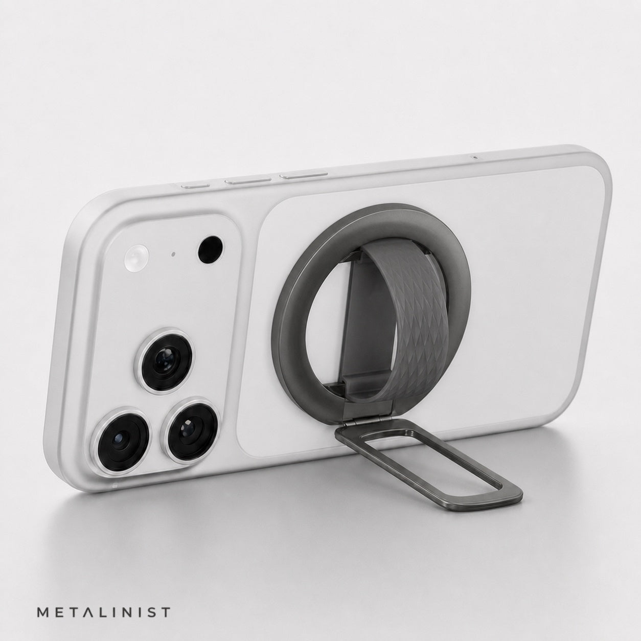 Grey METALINIST magnetic phone ring holder used as a landscape phone stand