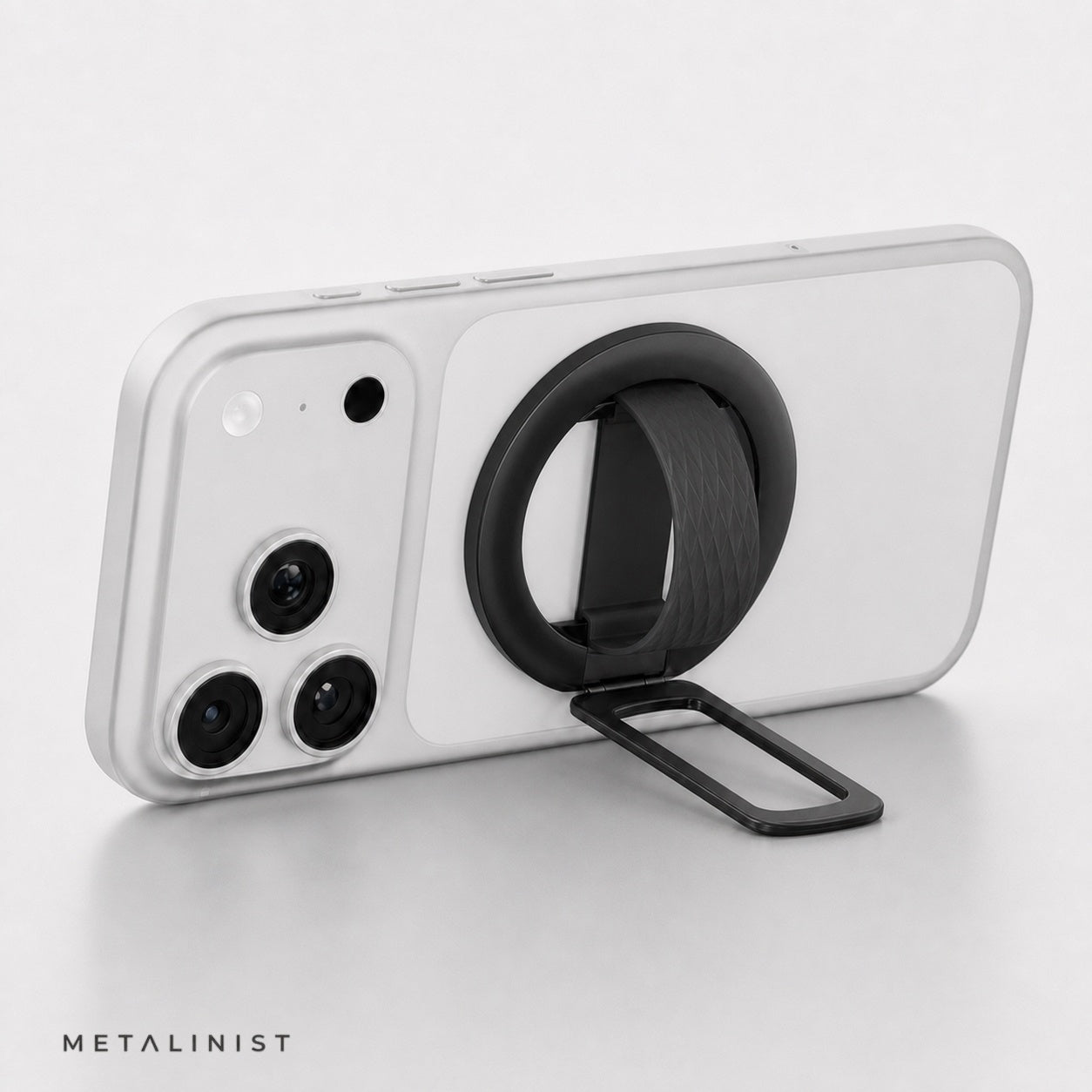 Black METALINIST magnetic phone ring holder used as a landscape phone stand